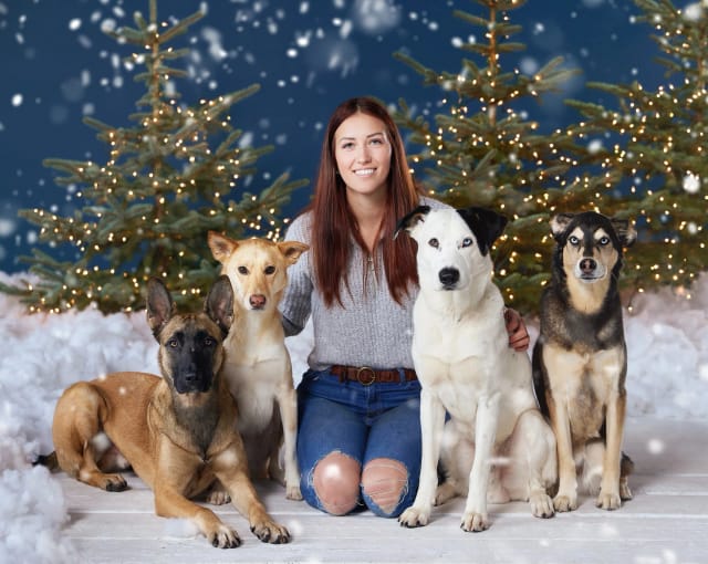 Natalia, owner of Wilde K9, with her rescue dogs at the facility